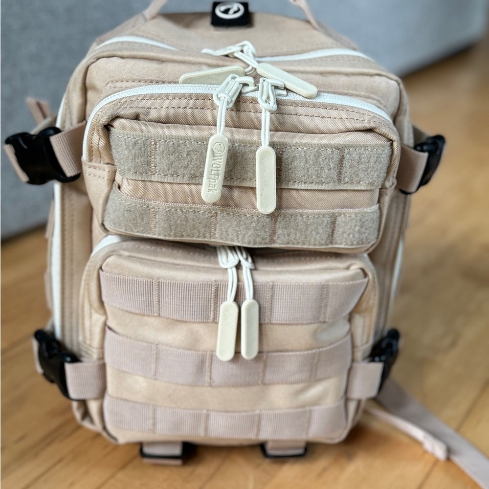Tan mini wolfpak backpack in like new condition